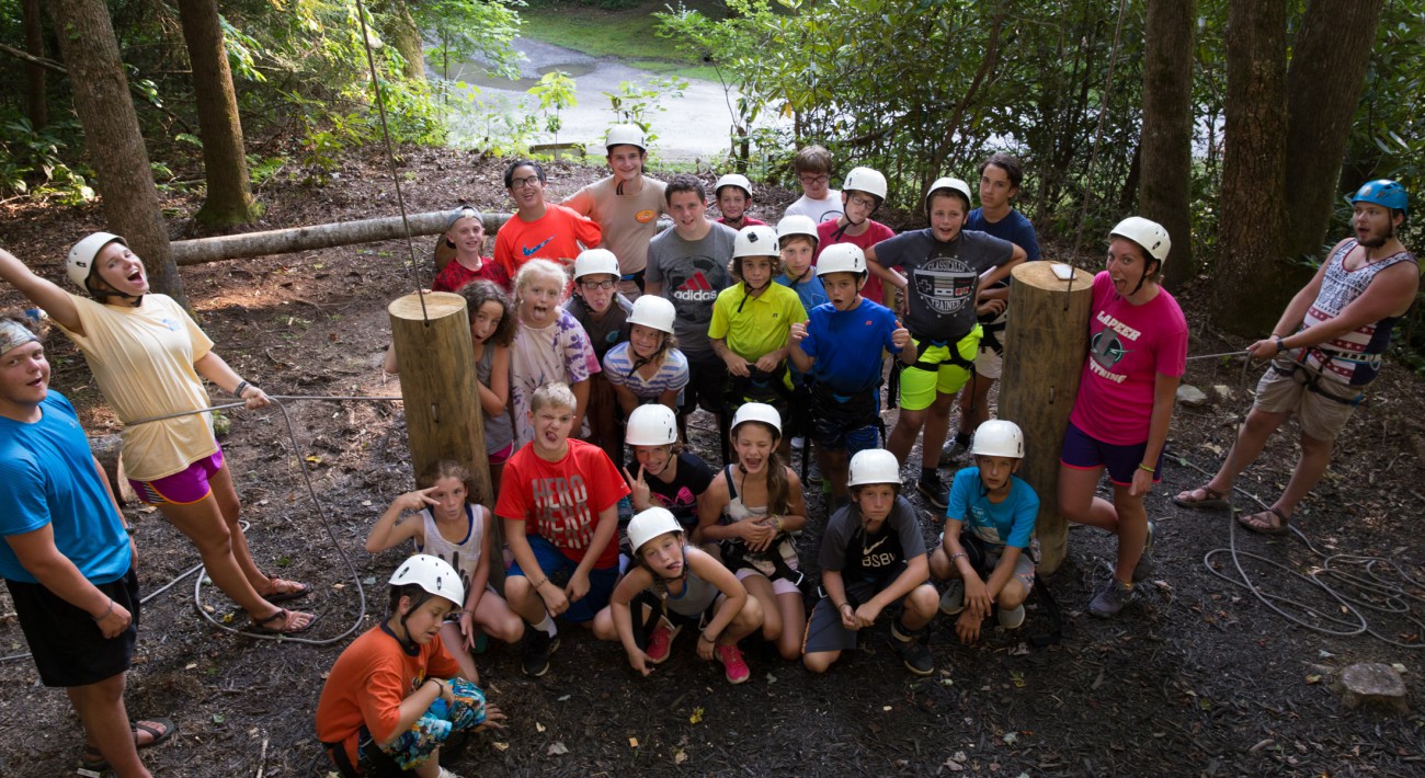 group of kids just finished climbing all having fun smiling