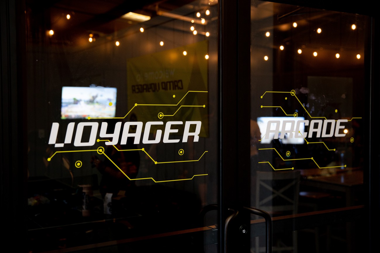 image of glass door which says voyager on it.