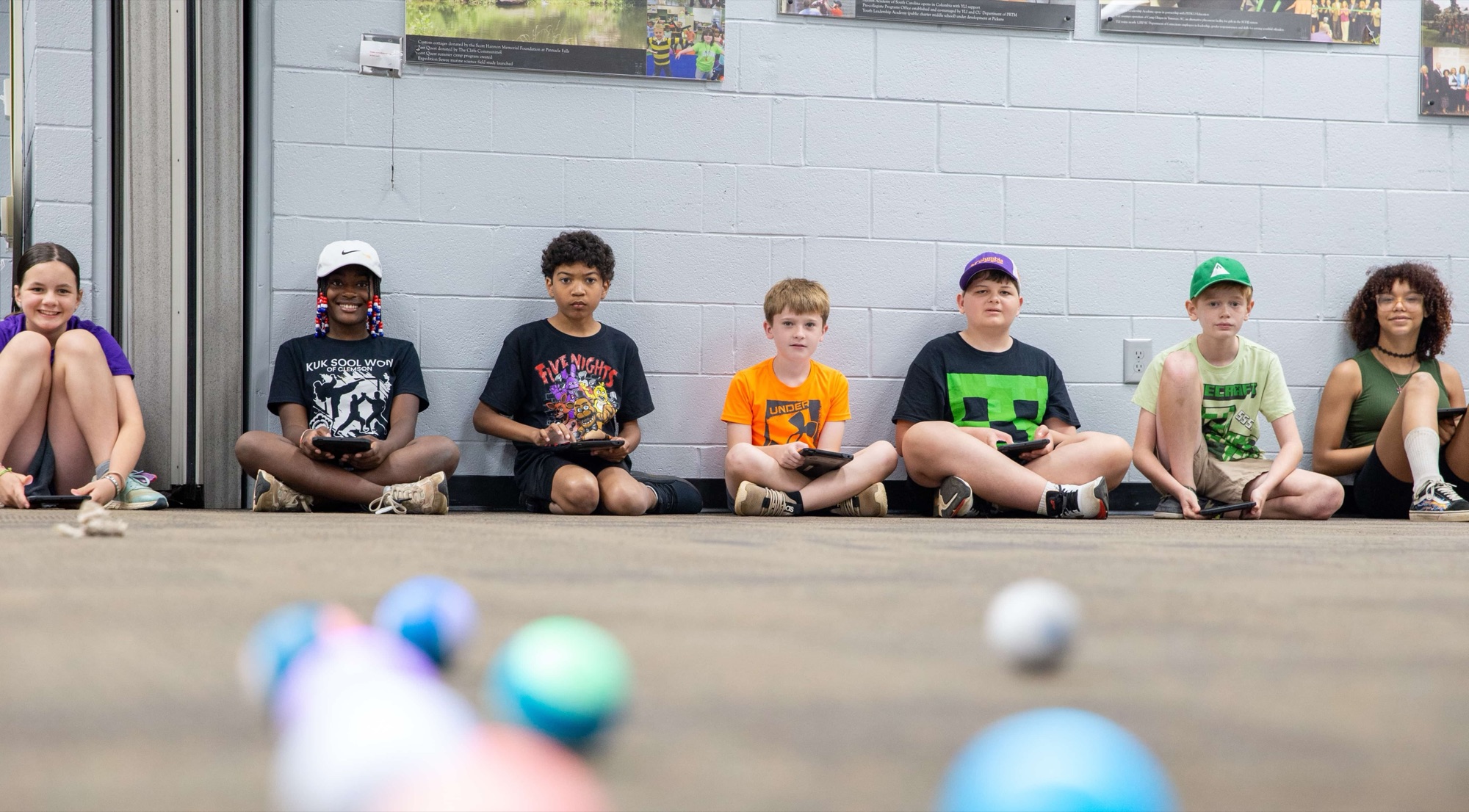 group of children playing a game with a counselor