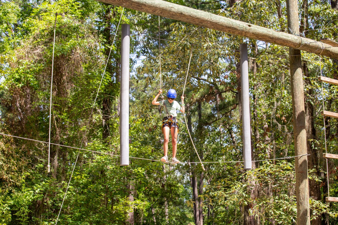 Student on the ropes course.