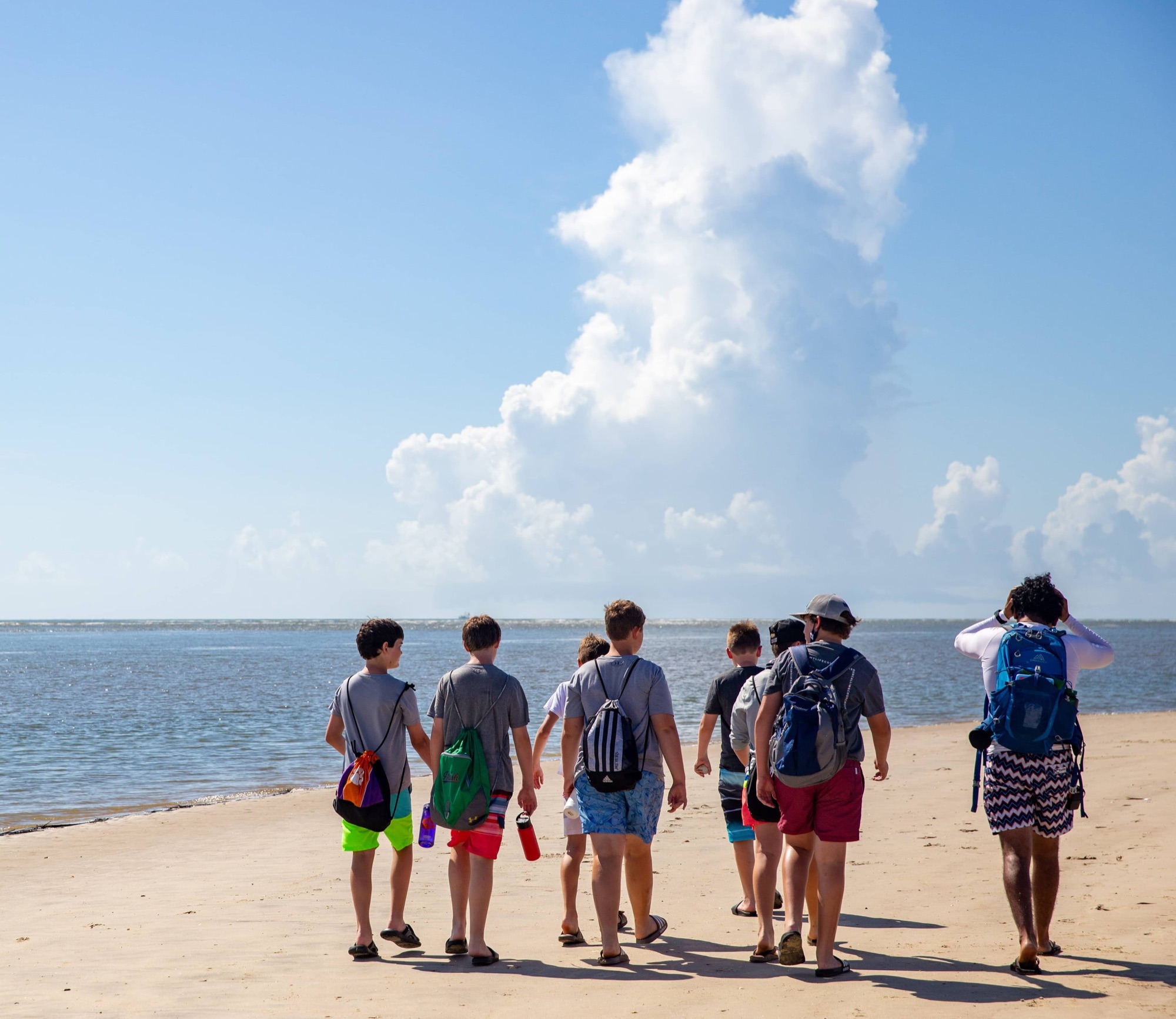 Boys walking on the beach