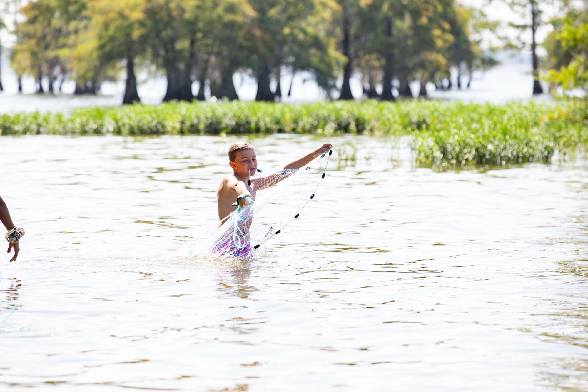 Boy throwing a net